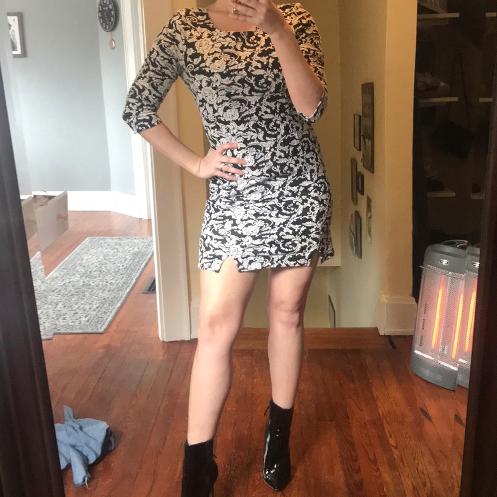 Black and white long sleeved formal dress